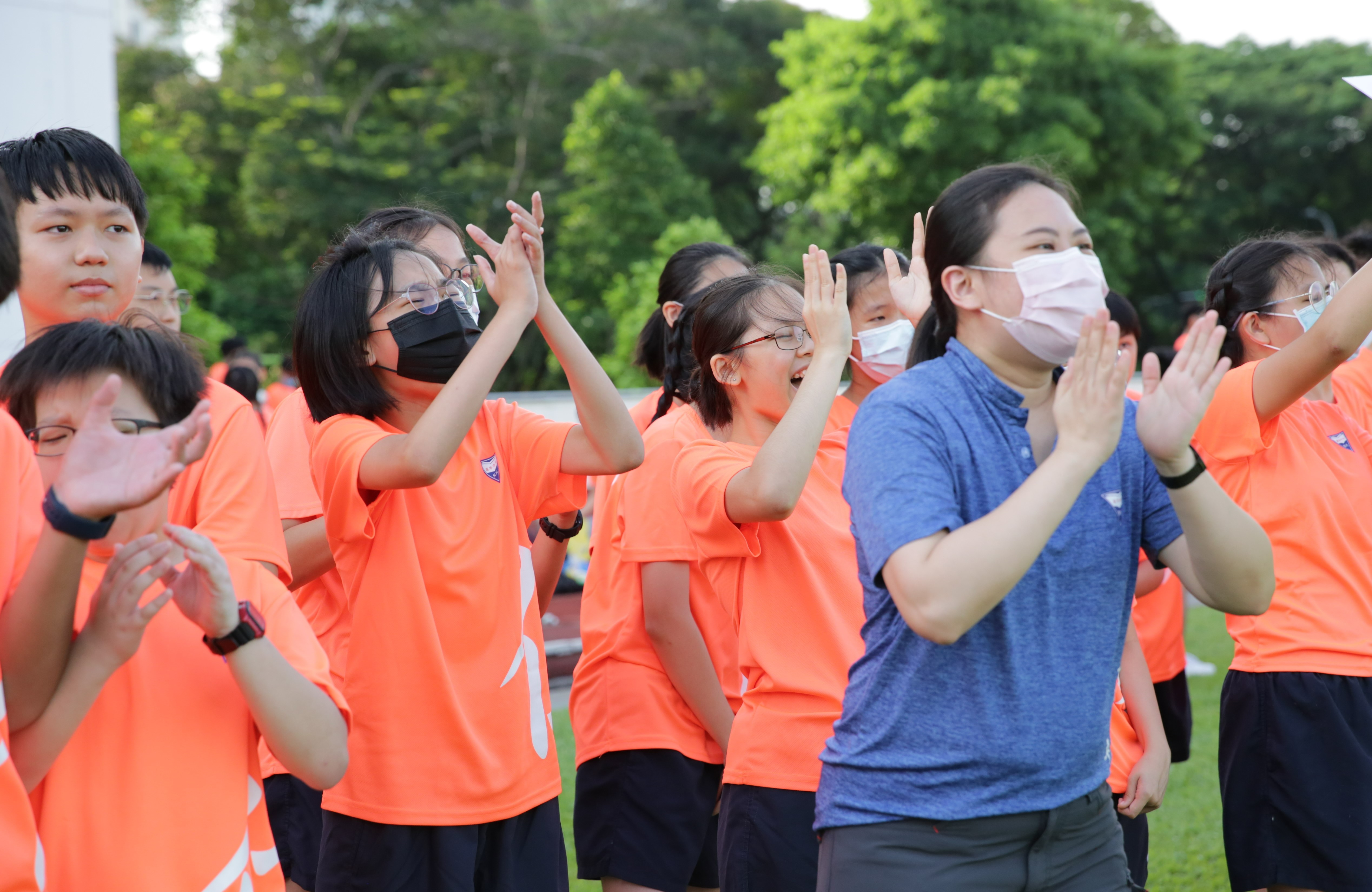 Cheering on their classmates!