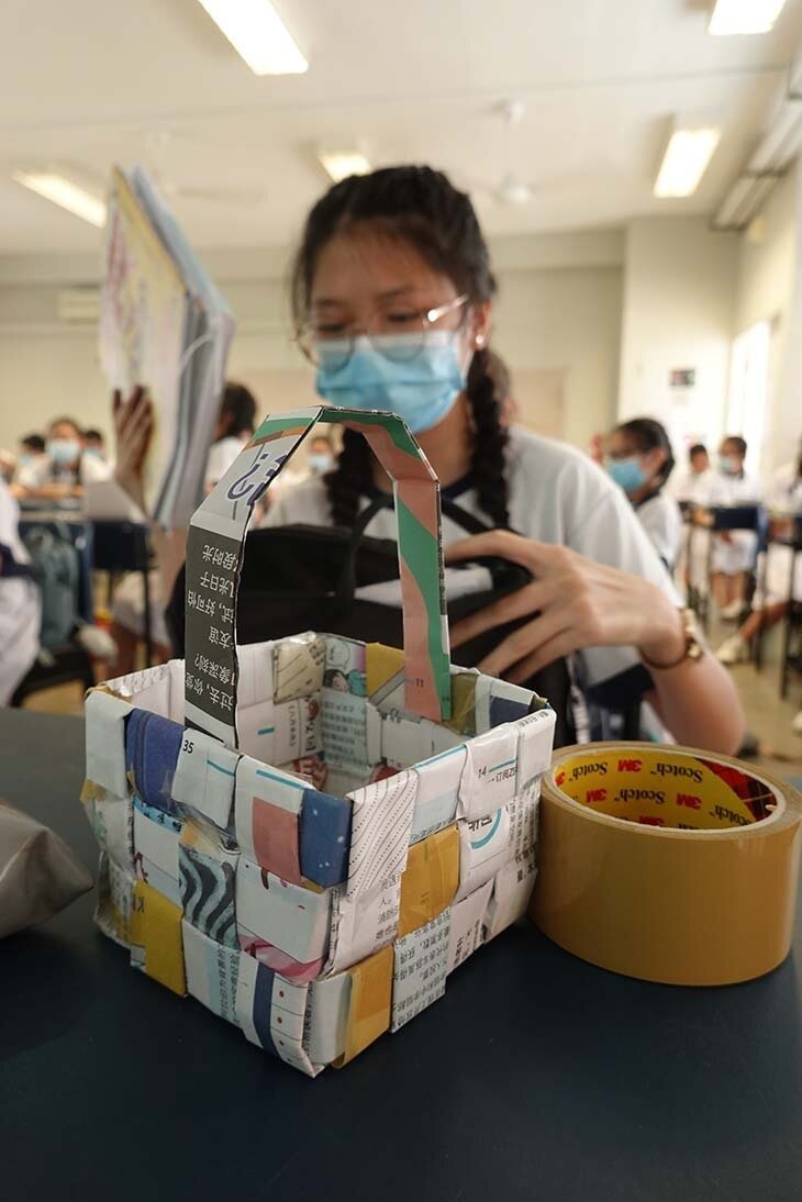 A student with her basket made from recycled materials.JPG